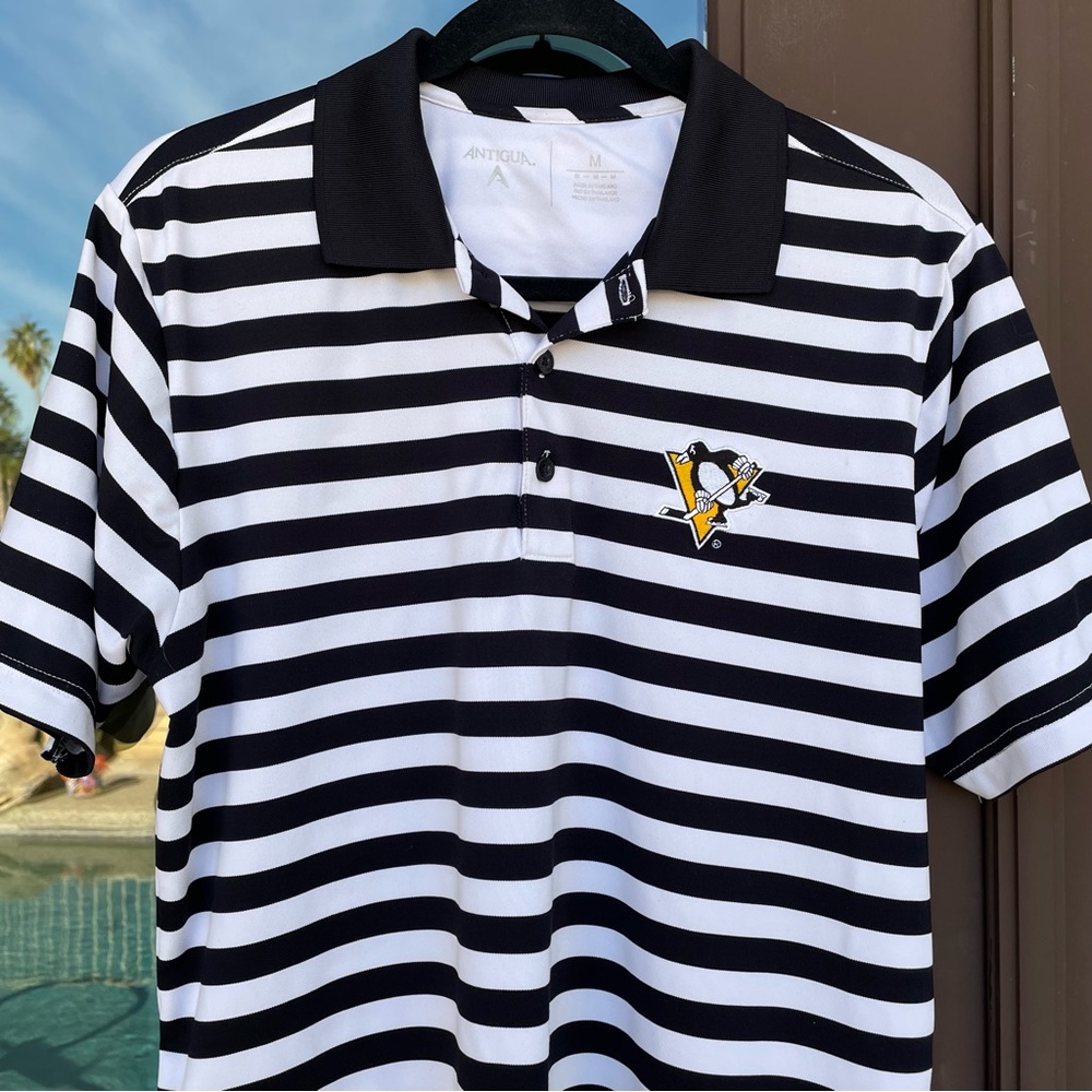 Antigua Men's Black & White Striped Polo with Pittsburgh Penguins Crest